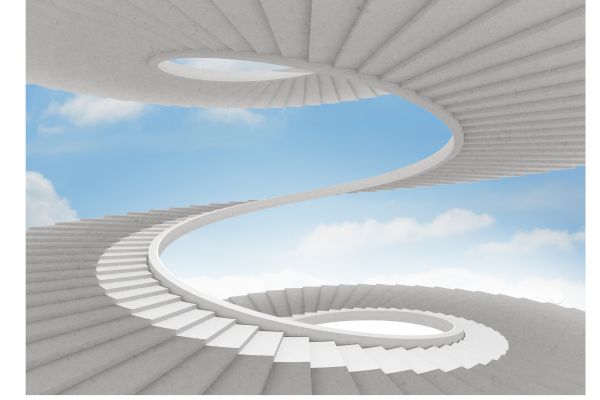 An intricate, endless white spiral staircase against a clear blue sky, symbolizing the winding journey through the Stages of Grief.
